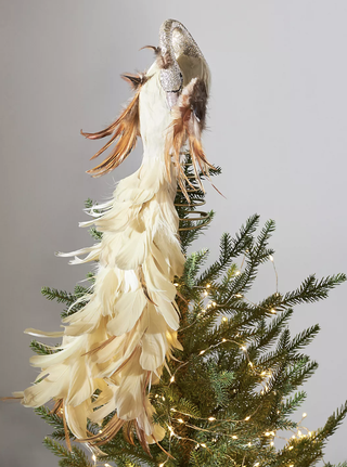 Warmly toned peacock Christmas tree topper from Anthropologie.