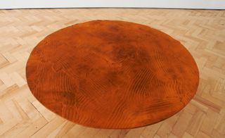 Orange, cast-iron tabletop