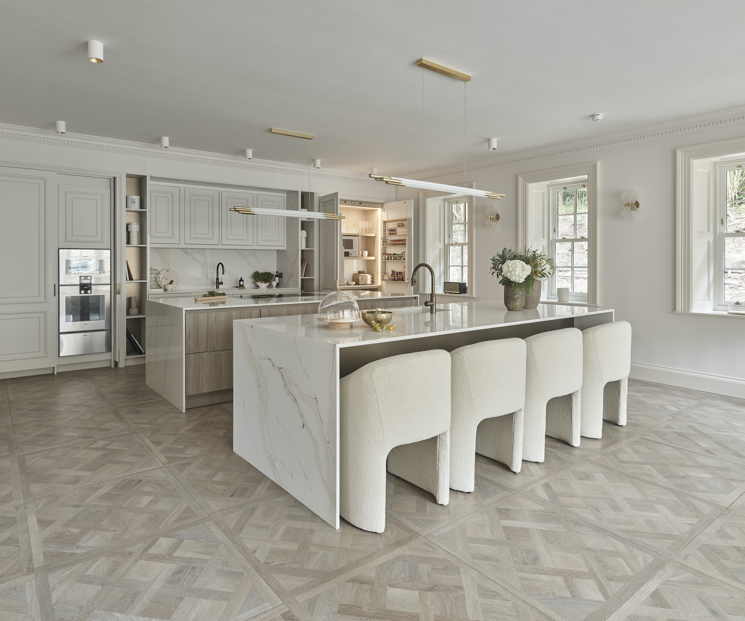 kitchen with two marble clad islands