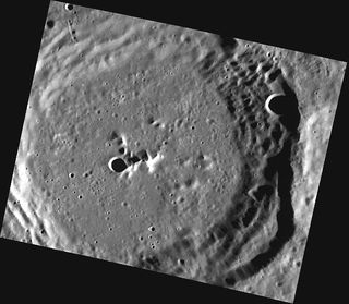 This May 4, 2011 image shows March crater, named for the 15th century Valencian poet Ausiàs March. The faint striations across the wall terraces in the lower right portion of the image may have been caused by landsliding or by emplacement of ejecta from a