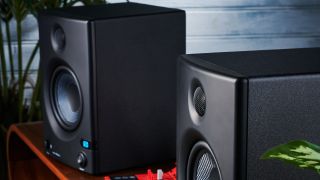 A pair of PreSonus Eris E5 BT studio monitors on a studio desk