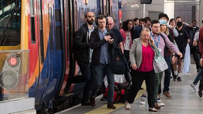 Commuters getting off a train