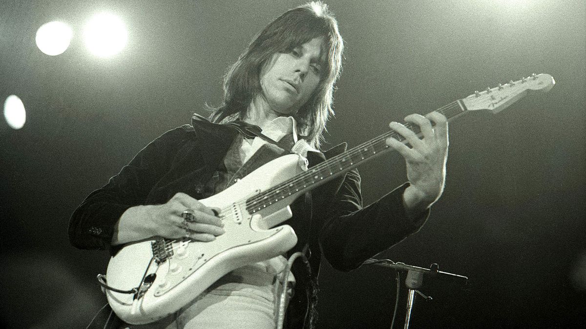 Jeff Beck plays a white Fender Stratocaster onstage in 1975