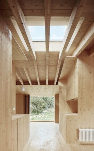 timber framed large openings define this Spanish countryside house