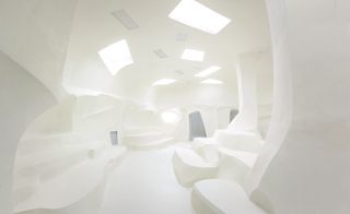 Image of a white set fashion set in a cave-like design