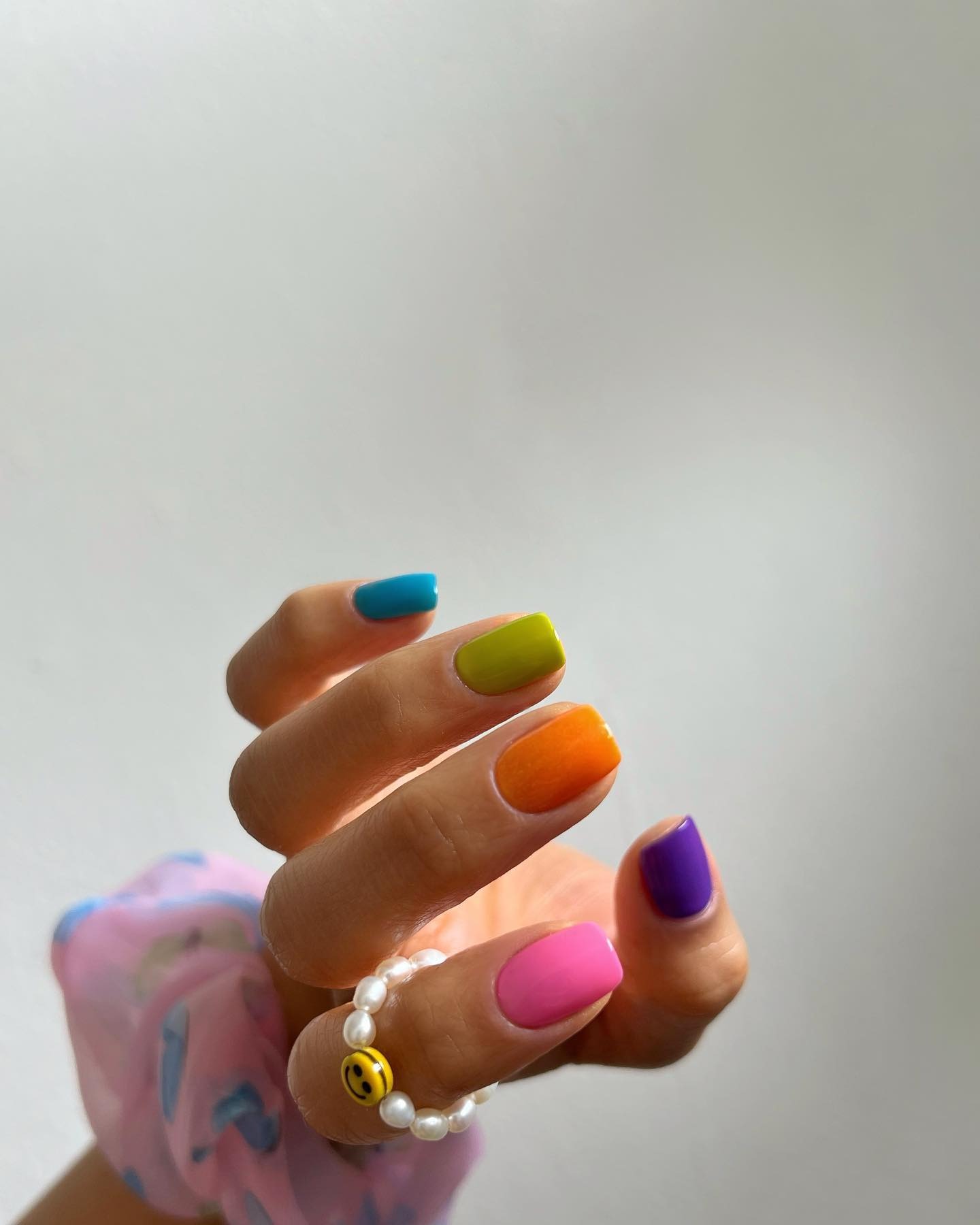 Colorful jelly bean nails with fun jewelry