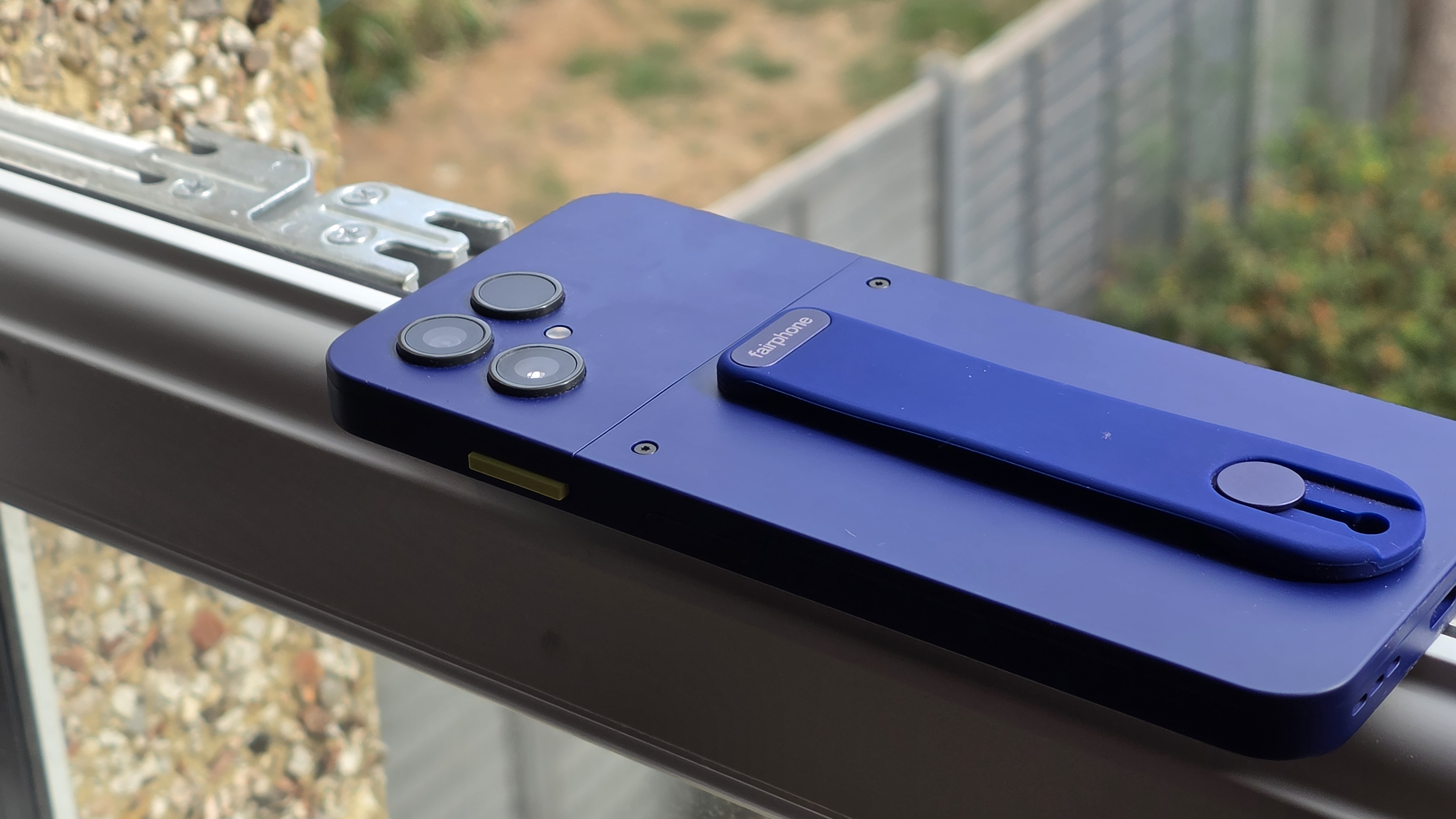 The Fairphone 6 Gen Plus resting on a window ledge