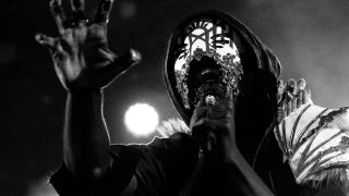 Sleep Token singer Vessel performing live in 2023