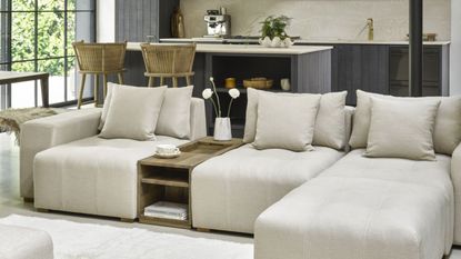 Cream coloured modular sofa in modern rustic living room