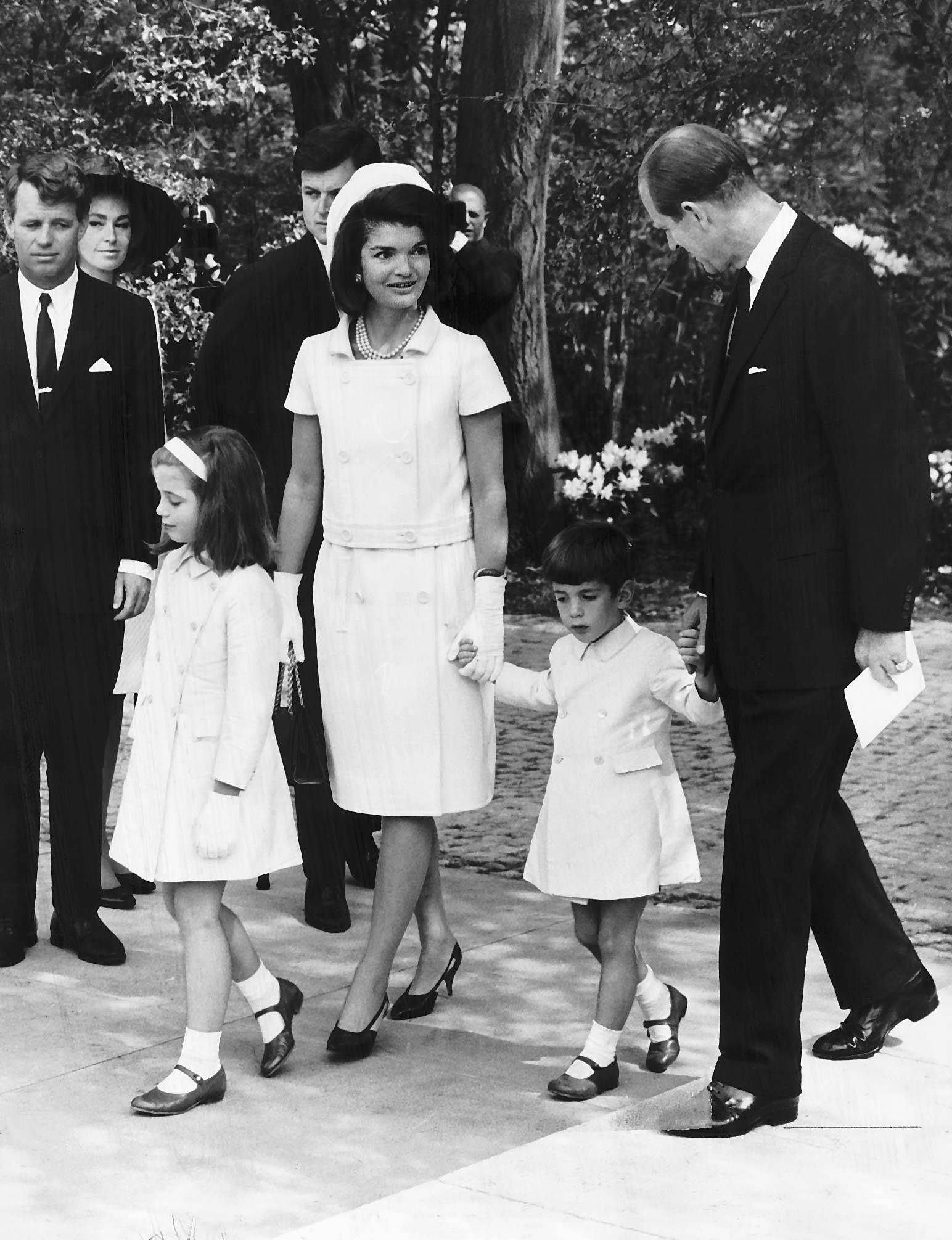 Jackie Kennedy, widow of assassinated US President John F. Kennedy, with her children Caroline and John F. Kennedy Jr., who held hands with Prince Philip at Runnymede for The Kennedy Memorial Stone ceremony May 14, 1965