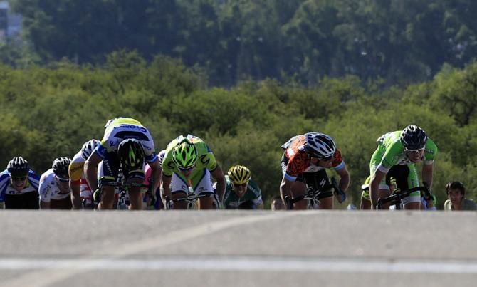 Race leader Mark Cavendish (Omega Pharma-Quick Step) checks the progress of Sacha Modolo (Bardiani-CSF Inox) in the sprint to the finish.