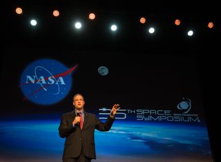 NASA Administrator Jim Bridenstine outlines the need for an international effort to return astronauts to the moon by 2024 during a speech at the 35th Space Symposium in Colorado Springs, Colorado on April 9, 2019.