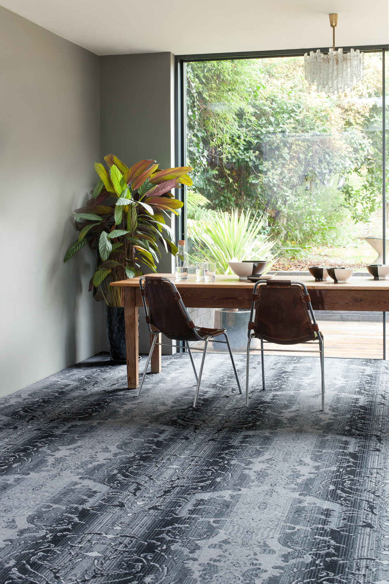 Dining room with dining furniture, view to garden, and carpet