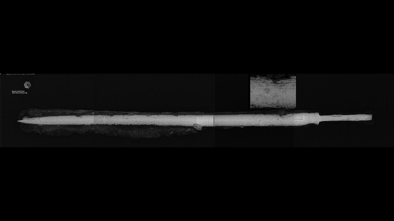 The sword seems to be of the medieval European style known as a longsword or "hand and a half" sword, which could be used with one or two hands.