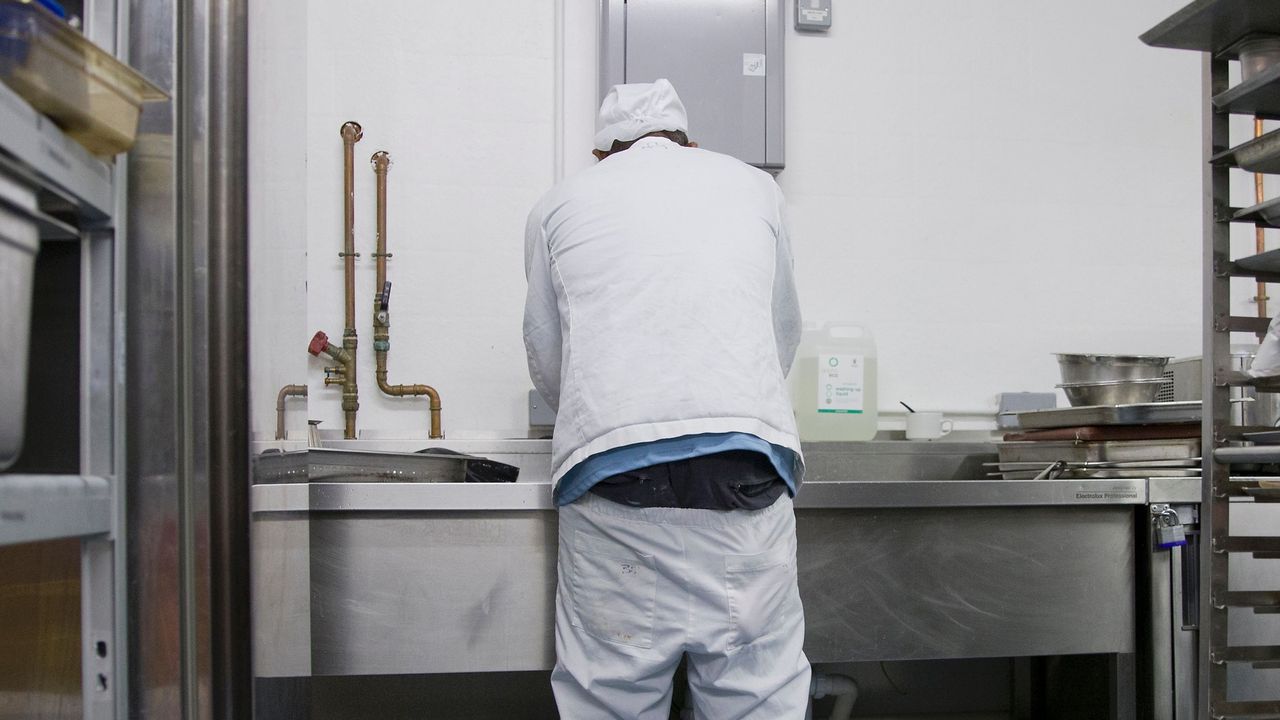 A prisoner works at The Clink restaurant inside HMP Brixton, south London