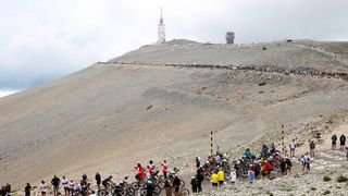 MALAUCENE FRANCE JULY 07 The peloton passing through Mont Ventoux 1910m mountain landscape during the 108th Tour de France 2021 Stage 11 a 1989km km stage from Sorgues to Malaucne Fog Public Fans LeTour TDF2021 on July 07 2021 in Malaucene France Photo by Michael SteeleGetty Images