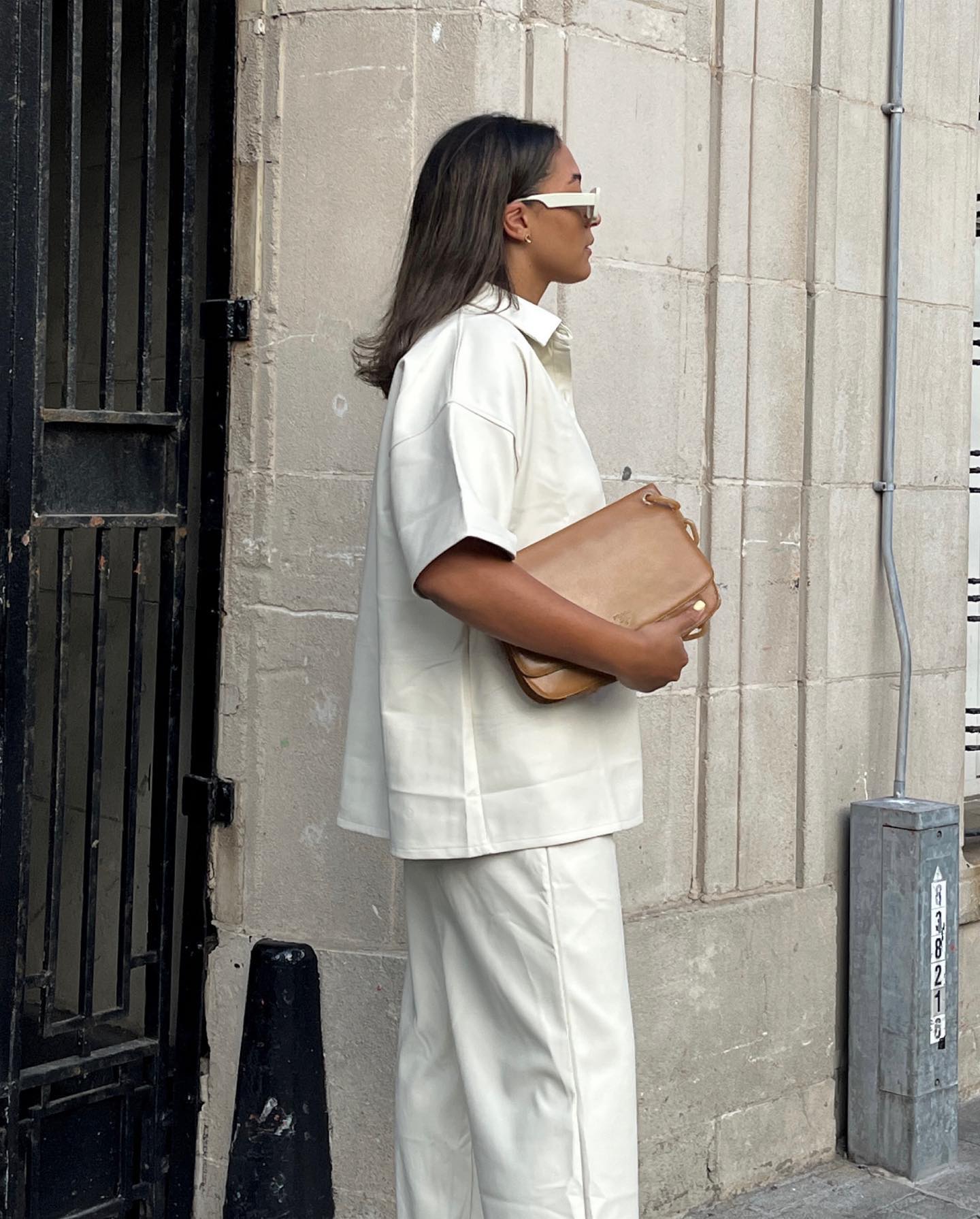 woman in all white with short hair