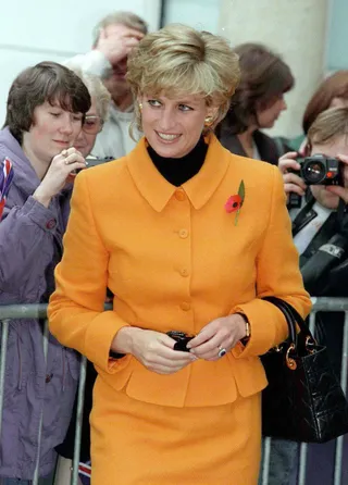 Princess Diana carries the Lady Dior bag in 1995 on a visit to Liverpool