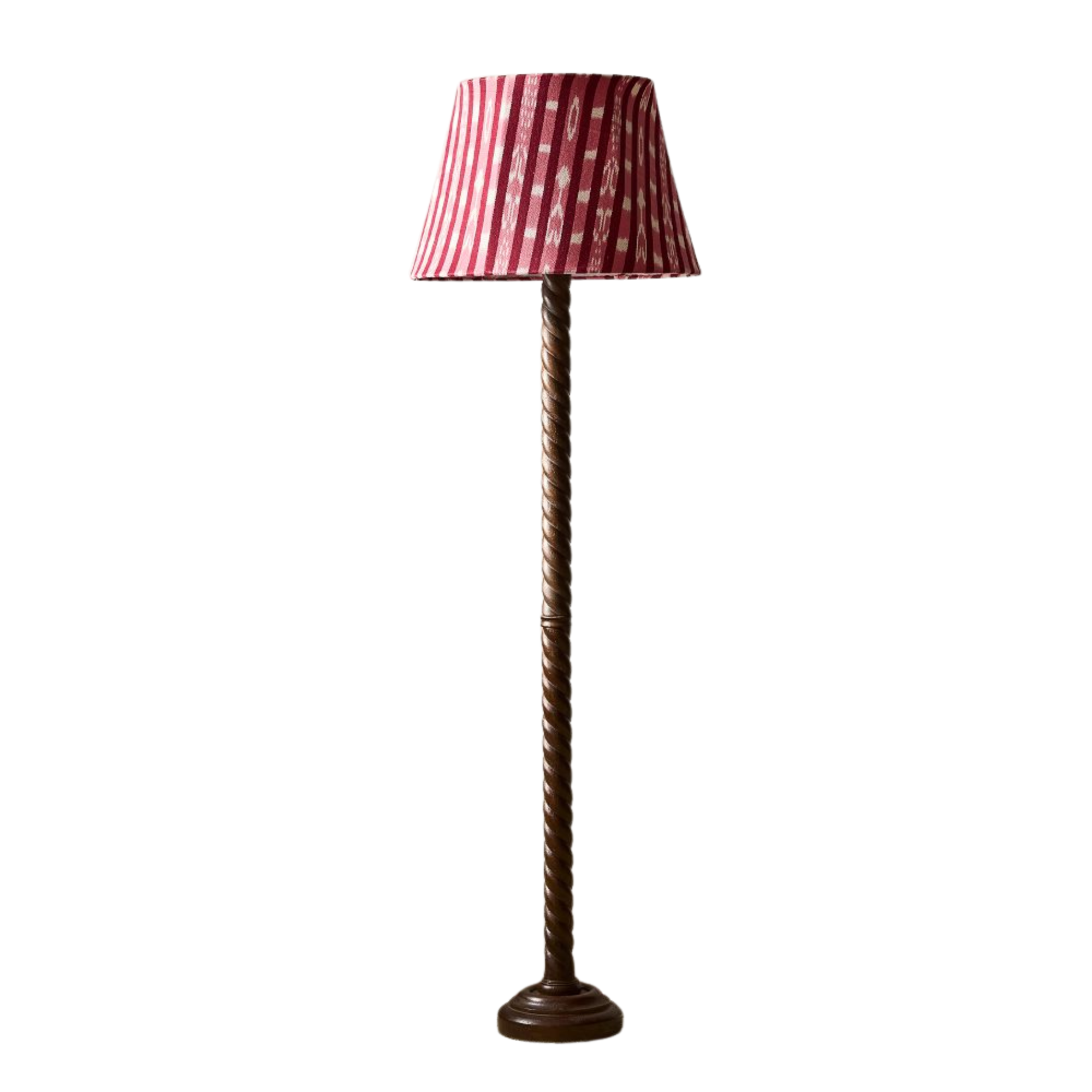 a floor lamp with a red shade and a twisted wood base