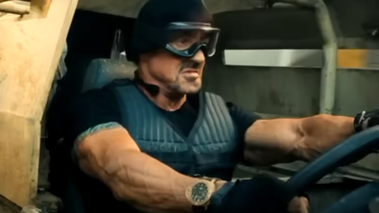 Sylvester Stallone driving a big truck in The Expendables 2