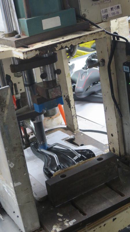 The rails are fitted into the base using a hydraulic press
