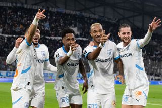 Marseille's French forward #08 Neal Maupay celebrates (L) with Marseille's Panamanian defender #62 Amir Murillo (2nd L), Marseille's Canadian defender #13 Derek Cornelius (2nd R) and Marseille's French midiefdler #25 Adrien Rabiot after scoring his team's third goal during the French L1 football match between Olympique de Marseille (OM) and Le Havre AC at Stade Velodrome in Marseille, southern France on January 5, 2025. (Photo by MIGUEL MEDINA / AFP) (Photo by MIGUEL MEDINA/AFP via Getty Images)