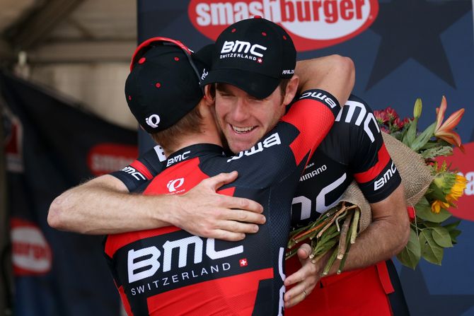 Rohan Dennis is congratulated for his victory by teammate Brent Bookwalter