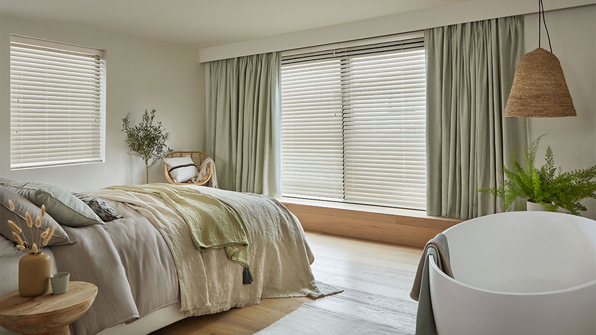 Japandi style bedroom with wooden blind and en suite bath