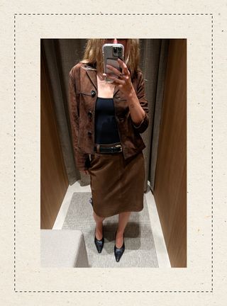 Eliza Huber in the dressing room at Massimo Dutti's new Miami store wearing a brown suede jacket and matching pencil skirt.