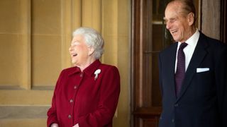 Britain's Queen Elizabeth II and Prince Philip, Duke of Edinburgh react as they bid farewell to Irish President Michael D. Higgins and his wife Sabina (not pictured) at the end of their official visit at Windsor Castle on April 11, 2014 in Windsor, United Kingdom.