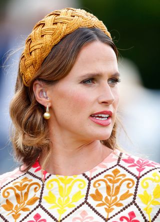 Francesca Cumani (wearing an Eponine London dress and Juliette Botterill Millinery headband