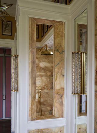 gold shower with yellow marble surrounds