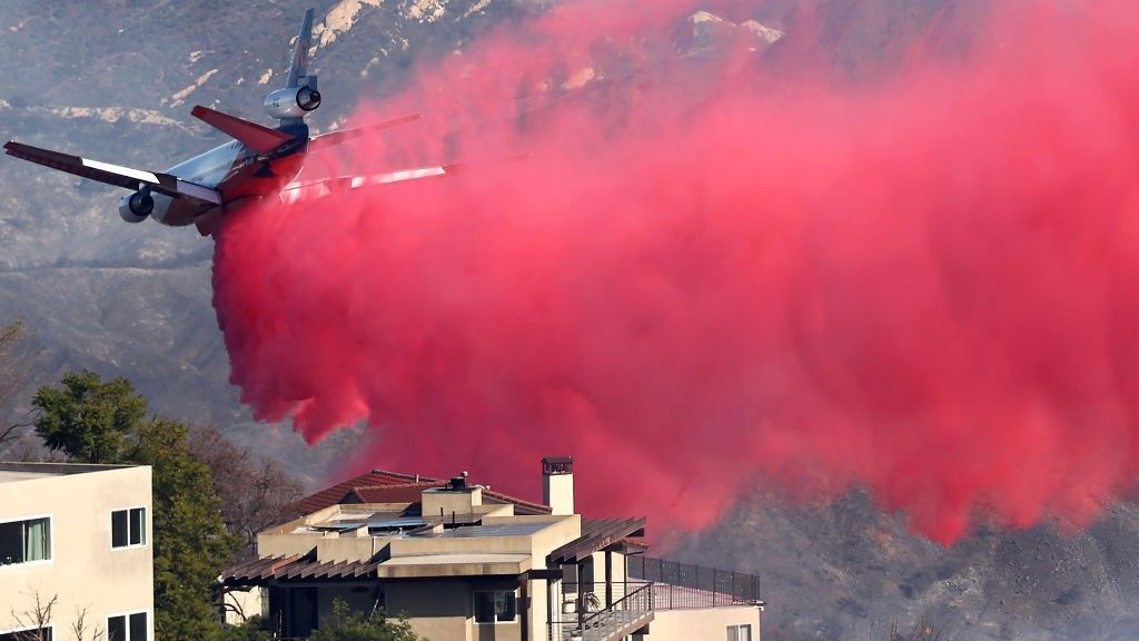 A plane drops pink flame retardant during the Eaton Fire in Los Angeles, California on Monday (Jan. 13).