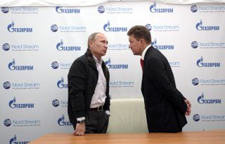 Vladimir Putin, Russia's prime minister, left, speaks to Alexei Miller, chief executive officer of OAO Gazprom, during the opening ceremony of the new Nord Stream pipeline near Vyborg, Russia, on Tuesday, Sept. 6, 2011. Gazprom will today start pumping natural gas into a $10 billion subsea pipeline from Russia to Germany, bypassing Ukraine, where disputes halted supplies to European customers twice since 2006.
