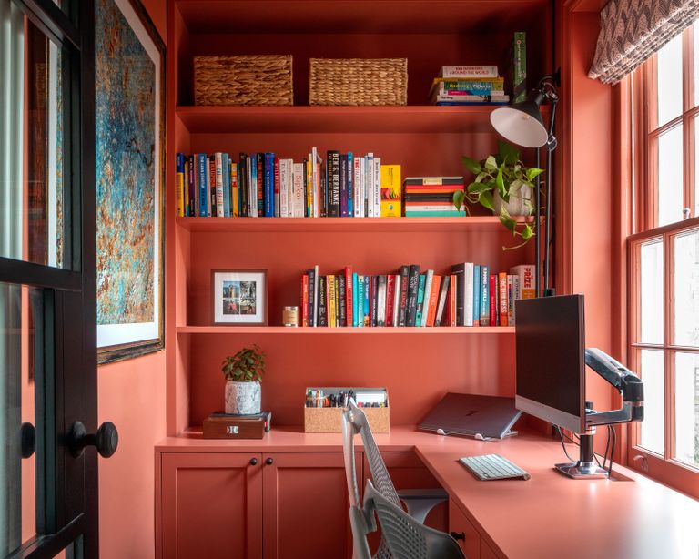 a home office painted in farrow and ball earth red