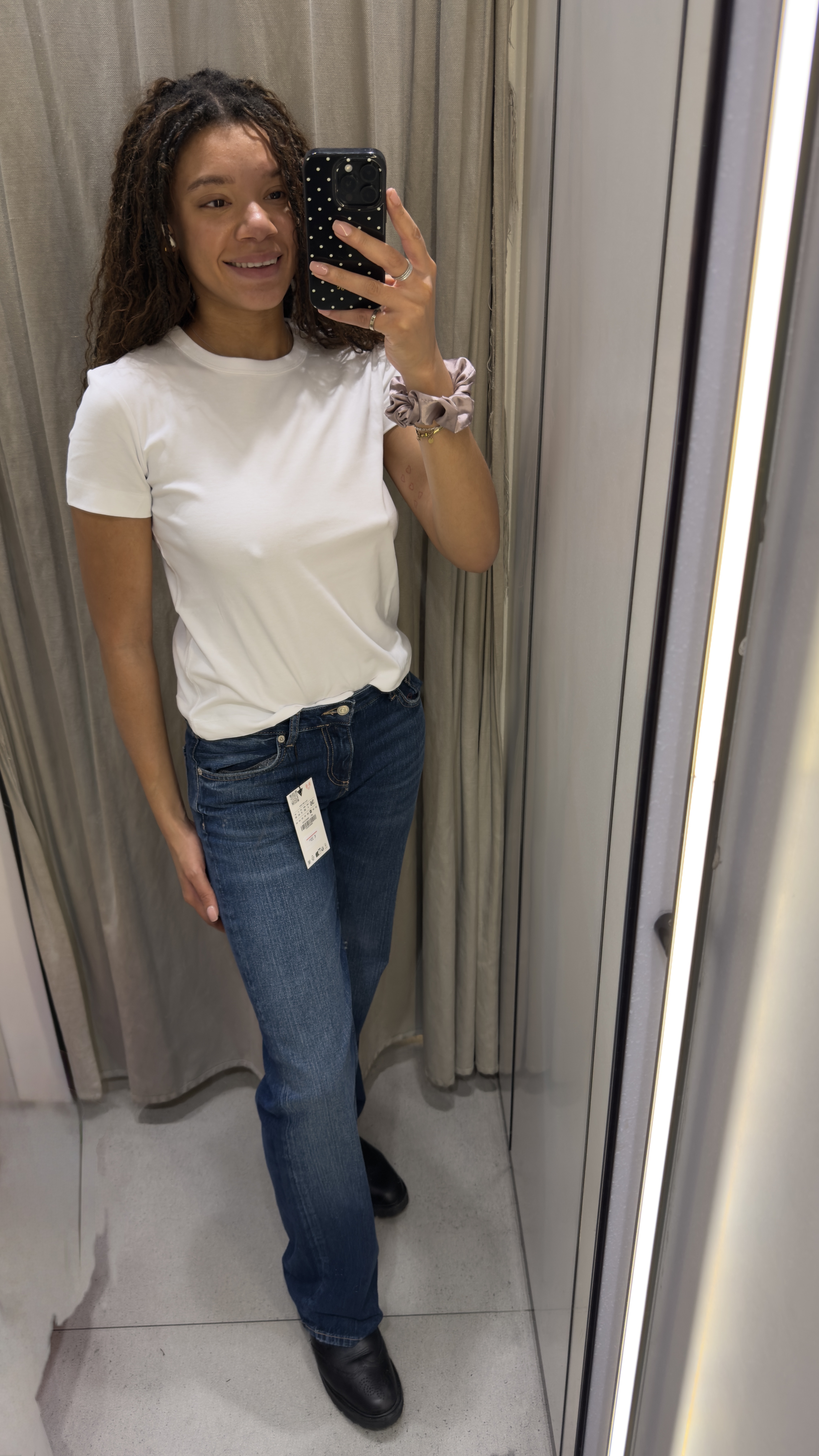 Junior fashion editor Imani wears the Zara high-rise straight-leg jeans.