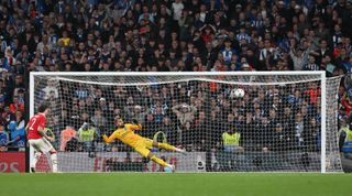 Victor Lindelof of Manchester United scores the winning penalty during the penalty shootout at the end of the FA Cup semi-final match between Brighton & Hove Albion and Manchester United at Wembley Stadium on April 23, 2023 in London, United Kingdom.