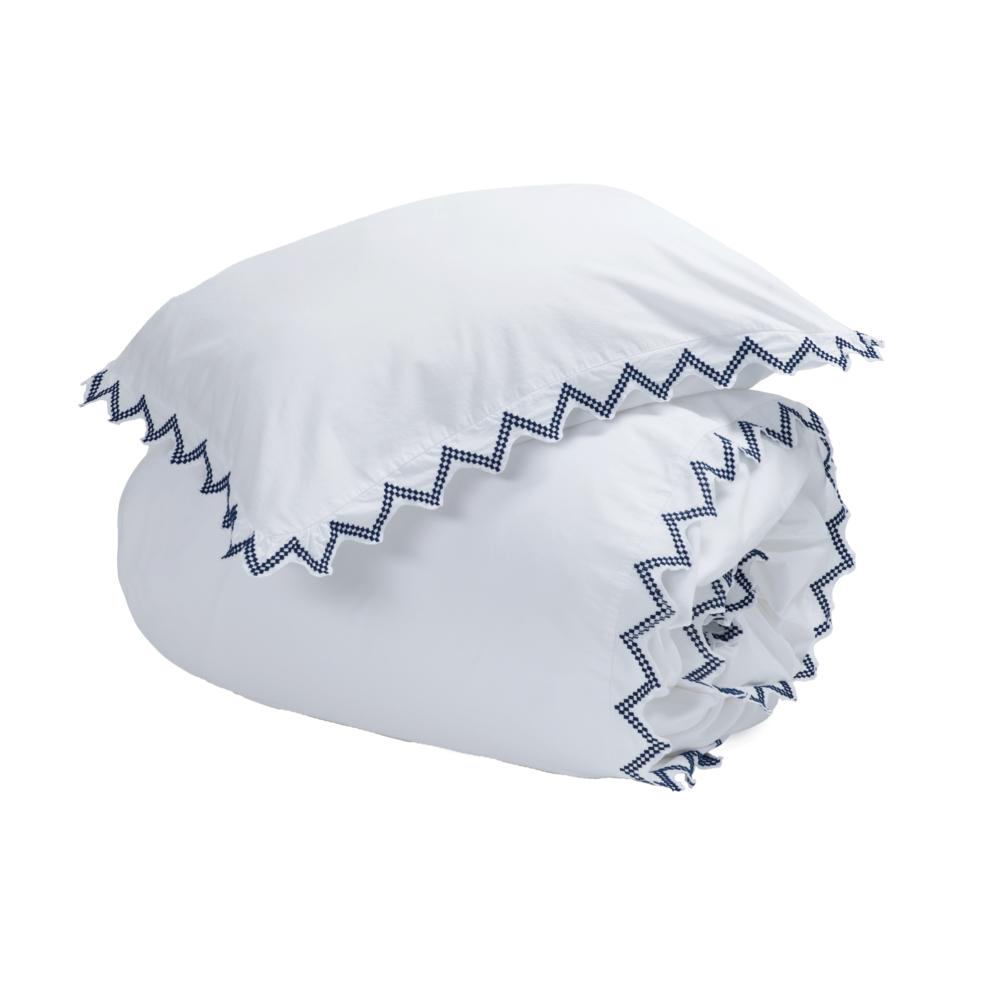 a white pillow and duvet cover with a triangular blue and white motif along the hem