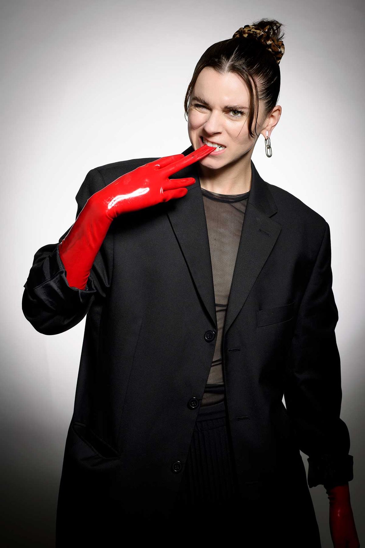 Lyndsey Gunnulfsen of the band Pvris poses for a portrait in red gloves