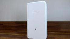 The TP-Link Omada EAP775 Wall 4 on a desk