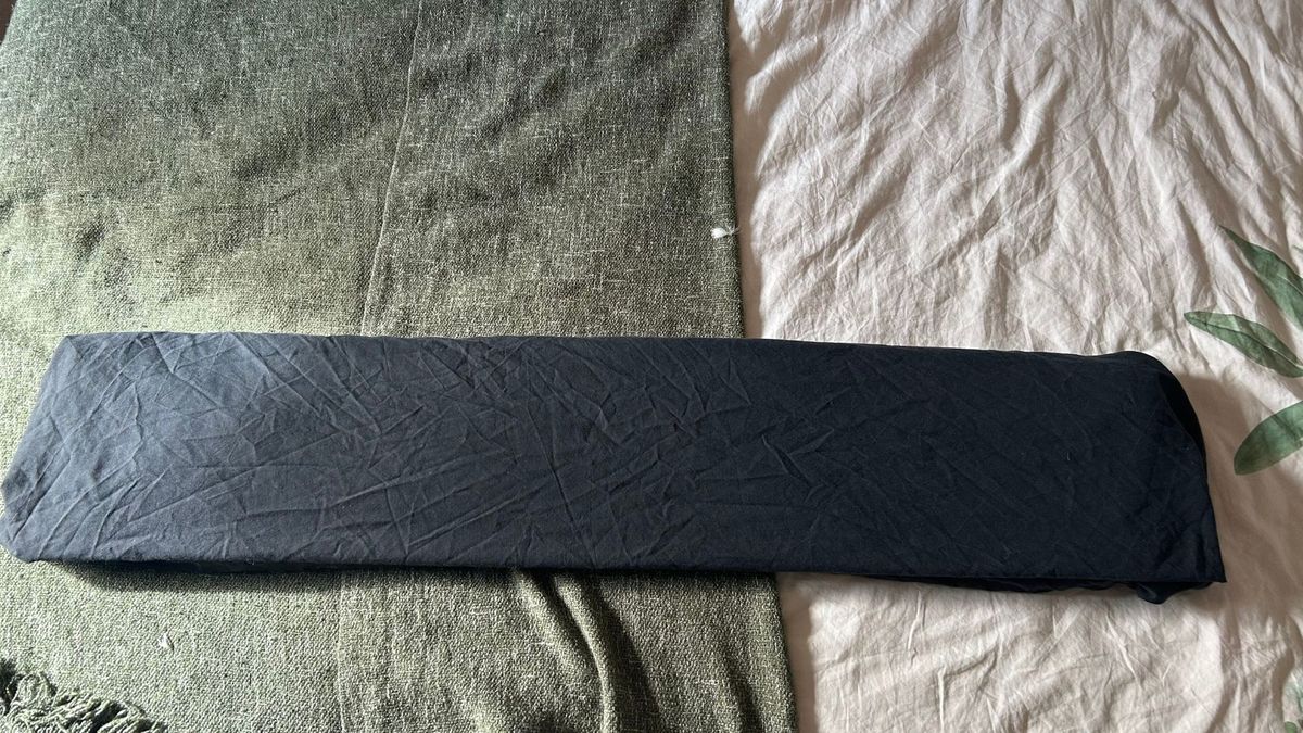 A black sheet folded into thirds