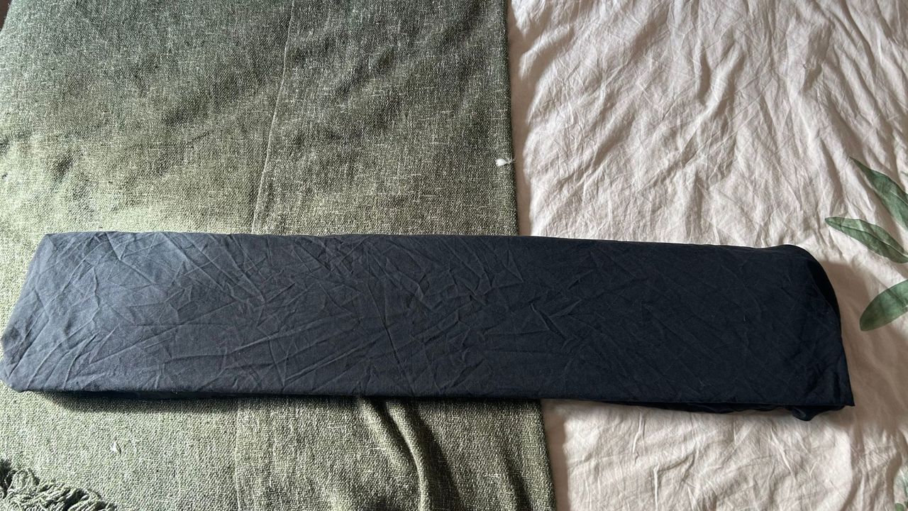 A black sheet folded into thirds