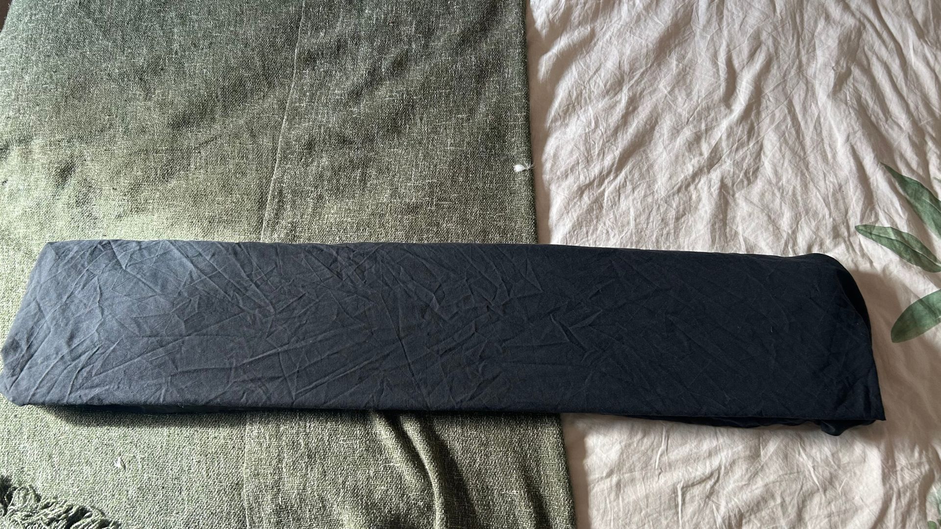 A black sheet folded into thirds