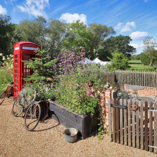 garden with telephone booth and cycle