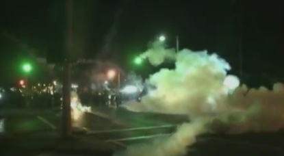 Watch Ferguson police bombard fleeing protesters with tear gas