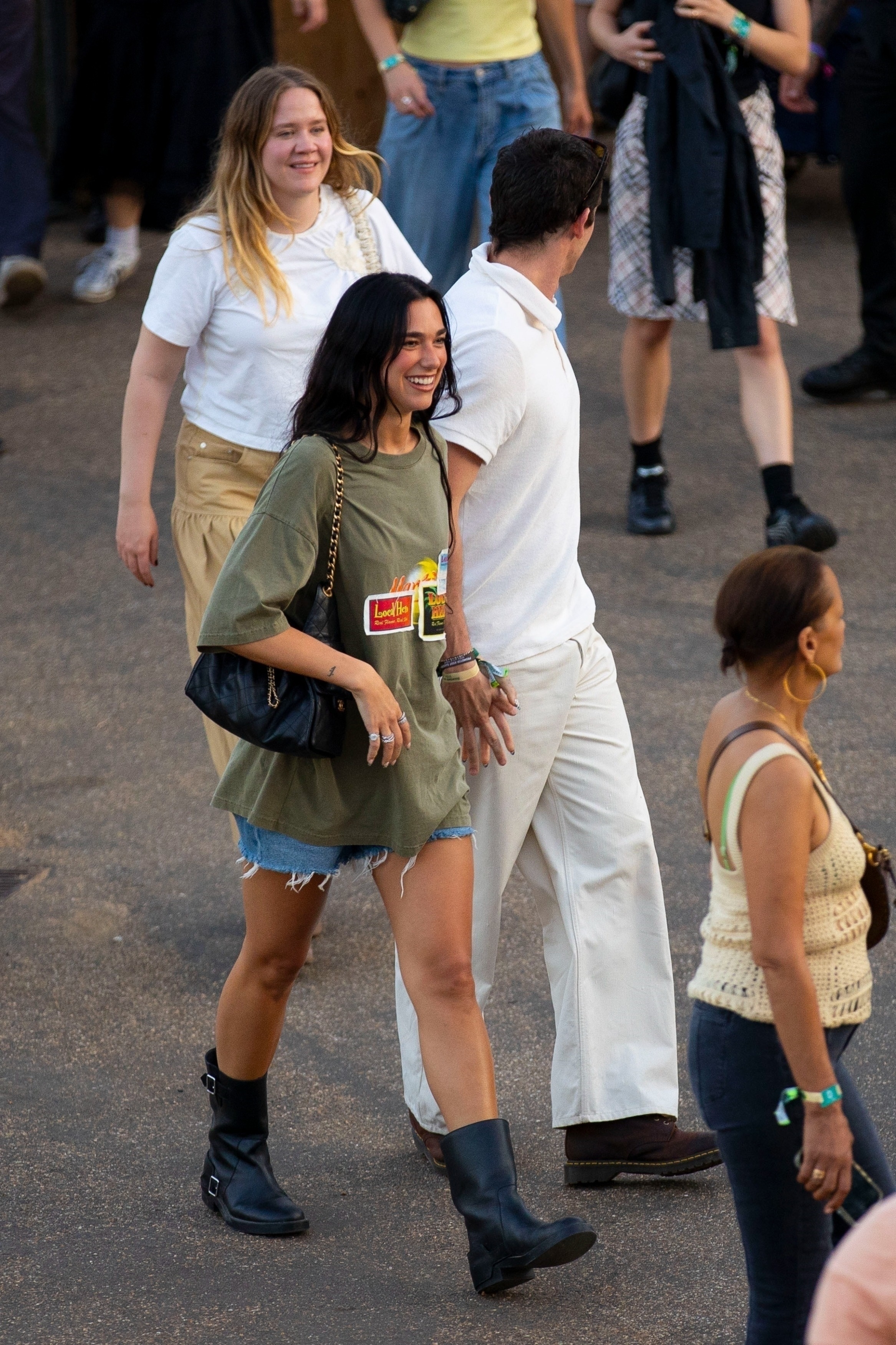 Dua Lipa visited Hyde Park in jean shorts, chunky ankle boots, and the Chanel 25 bag.