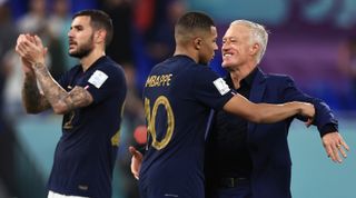 Didier Deschamps, Head Coach of France, celebrates with Kylian Mbappe after the 2-1 win during the FIFA World Cup Qatar 2022 Group D match between France and Denmark at Stadium 974 on November 26, 2022 in Doha, Qatar.