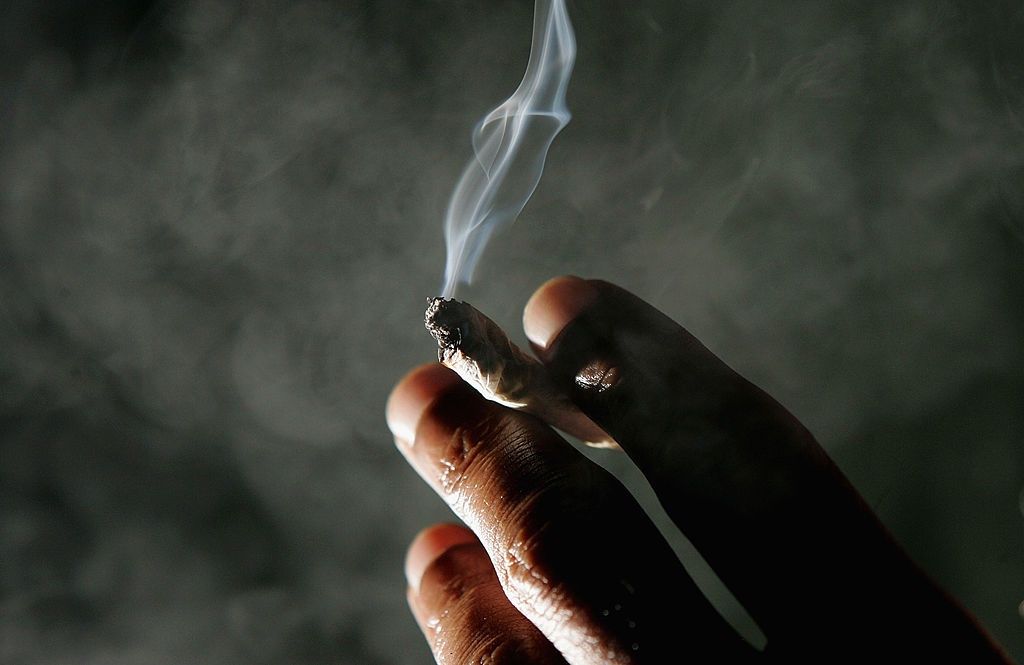 Jonathan Beaver of San Francisco holds a marijuana cigarette at the San Francisco Patients Cooperative, a medical cannabis cooperative, November 29, 2004 in San Francisco, California.