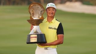 Haotong Li with the Qatar Masters trophy