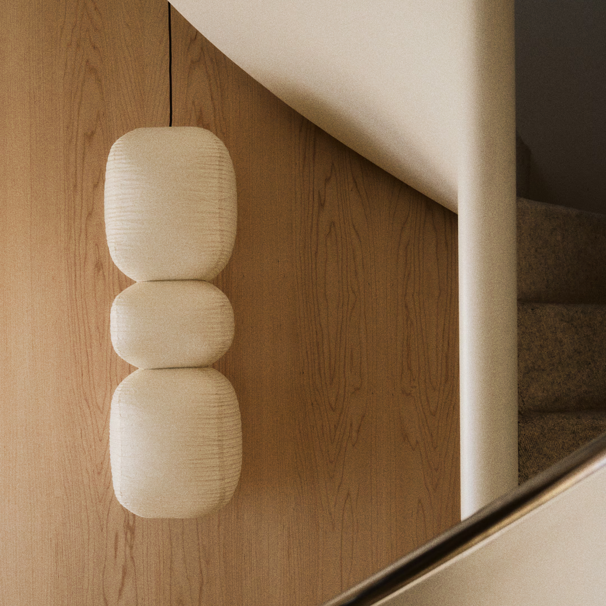 H&amp;M hanging paper lampshade on a staircase.